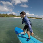 little surfer hawaii ocean beach